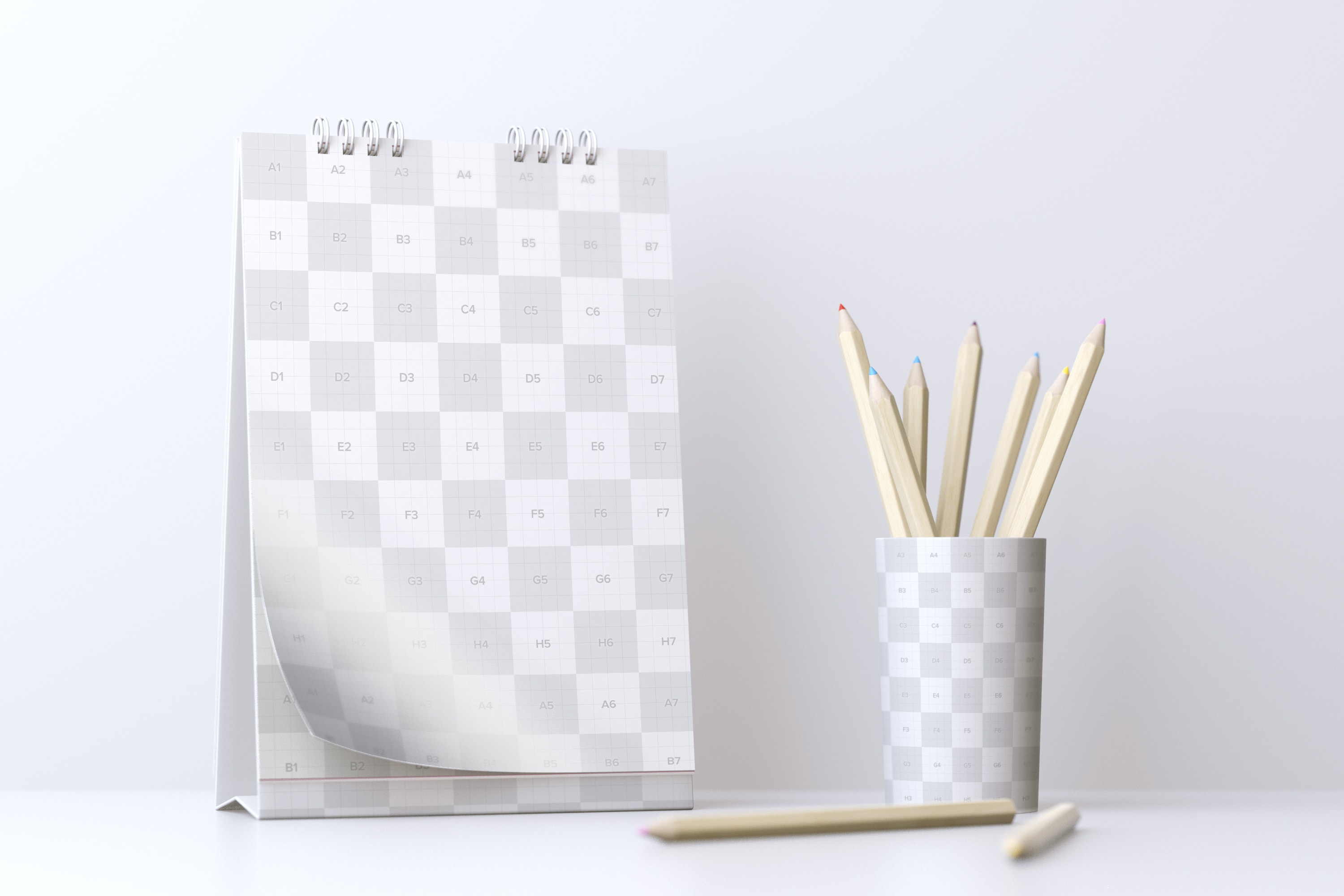 创意活页桌面日历设计样机模板 Desktop Portrait Calendar Mockup With Cup of Pencils插图